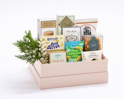 Grand Sweet Gift Box: Rustic Bakery vanilla cookies, Ritual and Dick Taylor chocolate, Claeys root beer candies, Date Better cinnamon baklava dates, Morito matcha latte, BonBon sour elderflower fish, Sir Walter Candy Co. peanut brittle and McCrea's peppermint caramels with holiday greenery