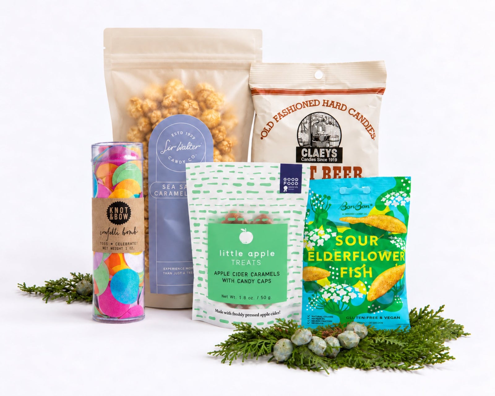 Celebration Gift Bundle: Sir Walter sea salt caramel popcorn, Claeys root beer hard candies, Little Apple Treats apple cider caramels, BonBon sour elderflower fish and a Knot & Bow confetti bomb