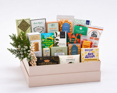 Reserve Sweet Gift Box: seventeen artisan sweets including Ritual, Dick Taylor, Eclat and Goodio chocolate, Sir Walter Candy Co. caramel popcorn, Little Apple Treats caramels, Roberts Ferry cinnamon bears, Claeys root beer candies and Date Better baklava dates, with holiday greenery