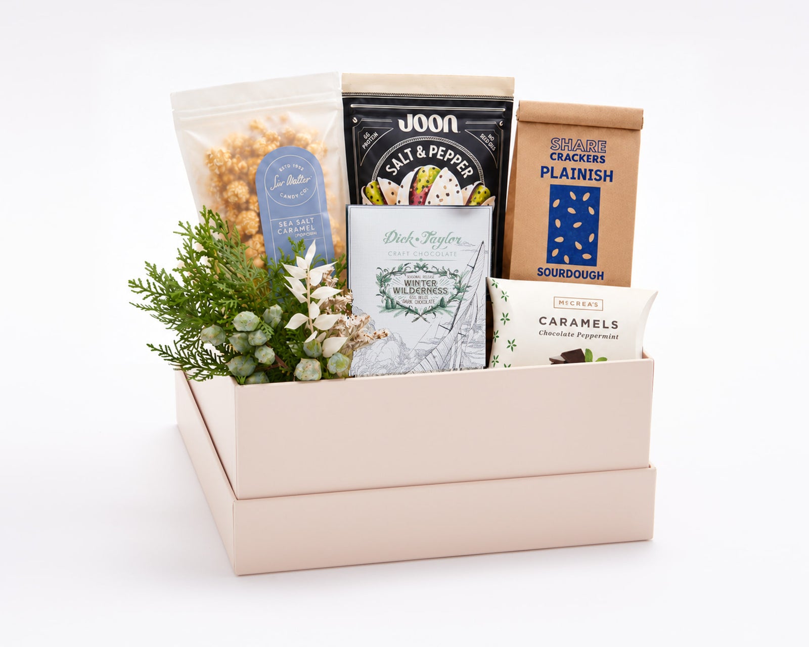 Signature Sweet & Savory Gift Box: Share Crackers Plainish sourdough crackers, Sir Walter Candy Co. sea salt caramel popcorn, Joon salt and pepper pistachios, Dick Taylor Winter Wilderness chocolate and McCrea's chocolate peppermint caramels with holiday greenery