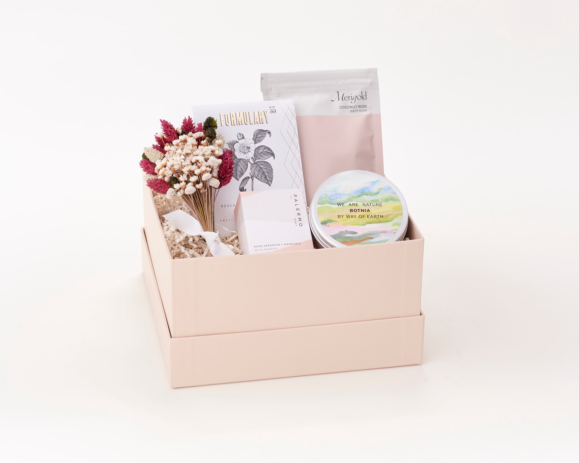 Spa Gift Box with Merigold Coconut Bath Soak, Botnia Body Cream, Formulary 55 Face Mask, and Palermo Soap Bar.