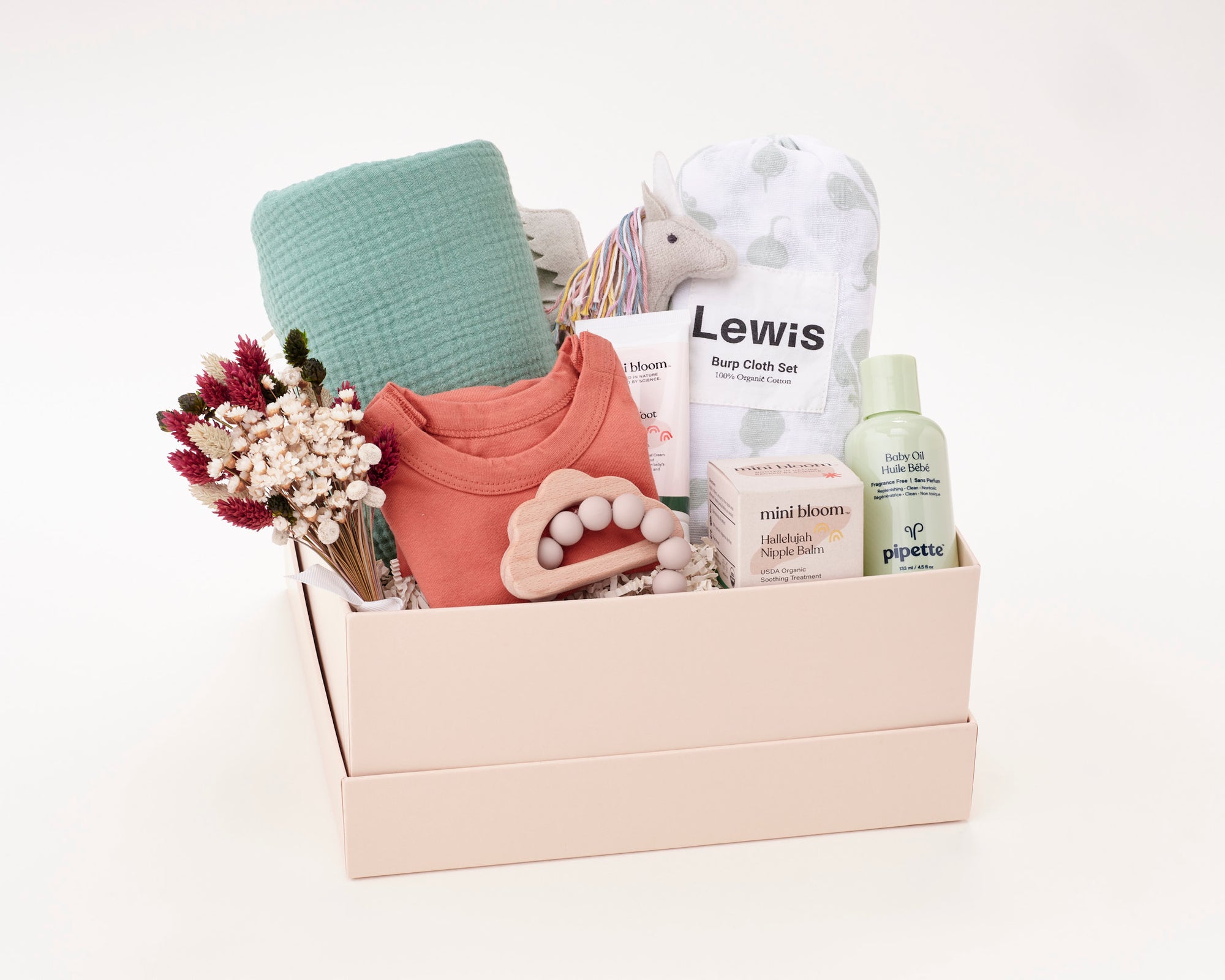 Baby Gift Box that includes Roux swaddle, Olli Ella Unicorn, Lewis Burp Cloth Set, Pipette Baby Oil, Mini Bloom Nipple Balm, Mini Bloom Toot Toot Diaper Cream, Tabeeze Onesie, and Marlowe and Sage Cloud Teether.